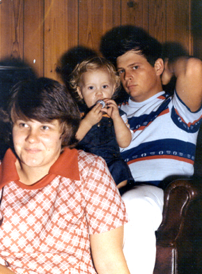 Jason on Mike's Lap with Patty in front smiling away